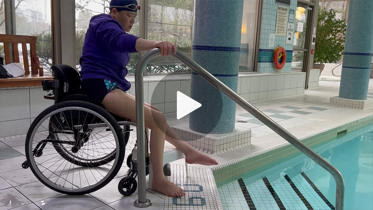 video thumbnail with woman in wheelchair preparing to enter a swimming pool